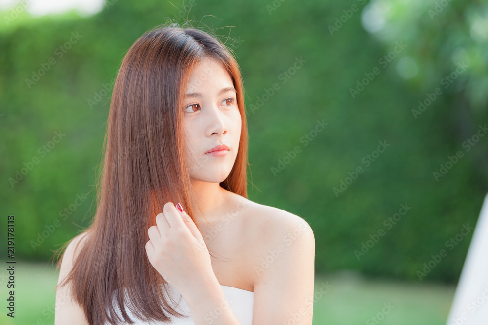 Thai beautiful young woman smiles and thinking. Thai beautiful young woman smiles and thinking.