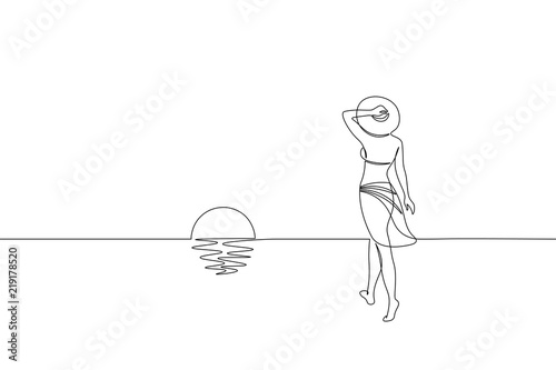Slika na platnu Continuous one single line art girl walking on sand beach concept
