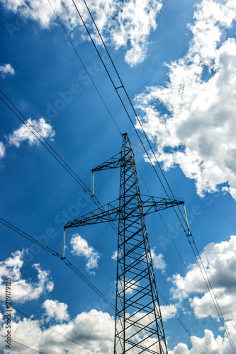 Power pylons and high-voltage lines against the background of the cloudy sky, power lines.