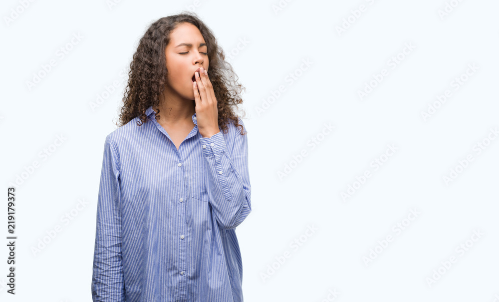 Young hispanic business woman bored yawning tired covering mouth with hand. Restless and sleepiness. Young hispanic business woman bored yawning tired covering mouth with hand. Restless and sleepiness.