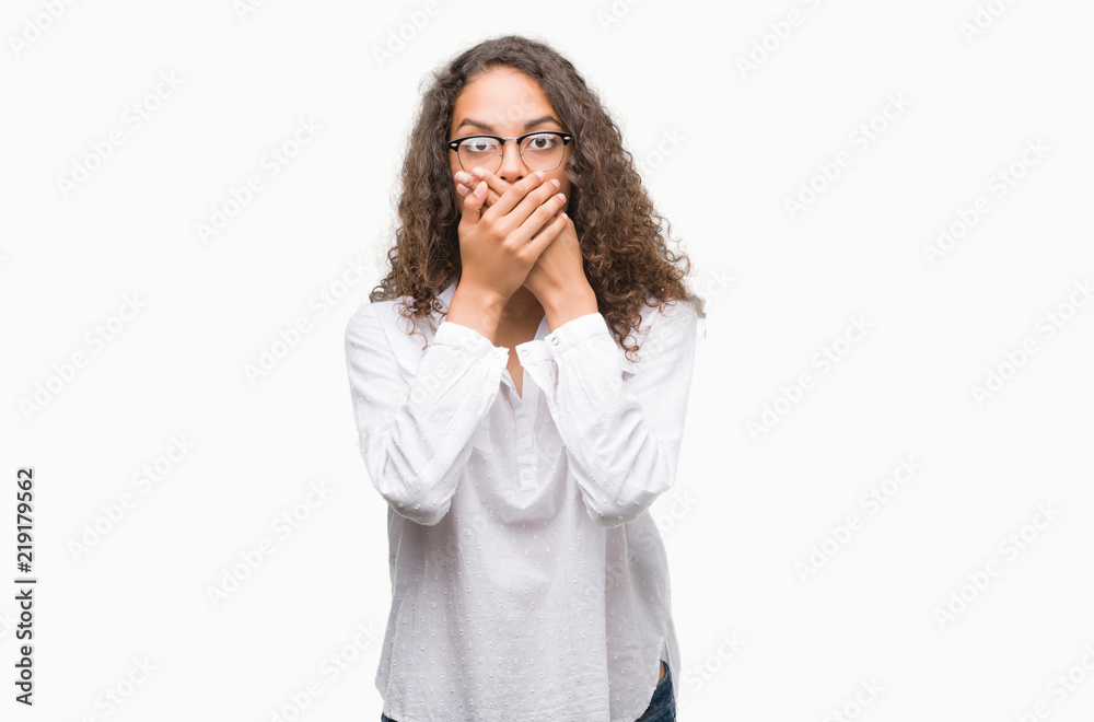 Beautiful young hispanic woman shocked covering mouth with hands for mistake. Secret concept. Beautiful young hispanic woman shocked covering mouth with hands for mistake. Secret concept.