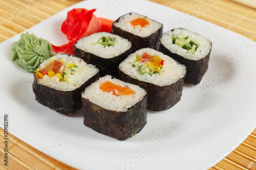 Wallpaper Mural Sushi rolls set with ginger and wasabi on a bamboo mat close up. Torontodigital.ca