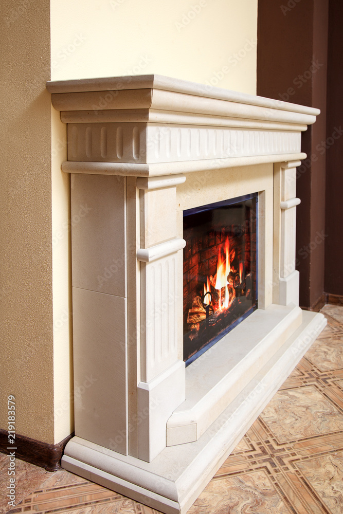 Granite marble fireplaces in the interior with handmade decor elements Granite marble fireplaces in the interior with handmade decor elements