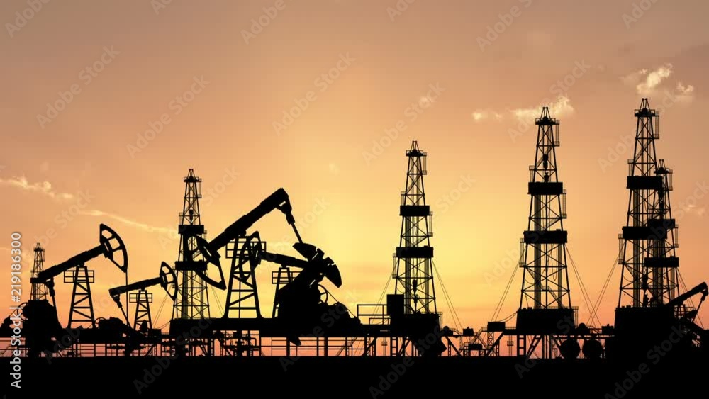 Silhouettes of working oil pumps and oil drilling rigs against the backdrop of the setting sun. Includes alpha matte for composing over footage or another background Silhouettes of working oil pumps and oil drilling rigs against the backdrop of the setting sun. Includes alpha matte for composing over footage or another background