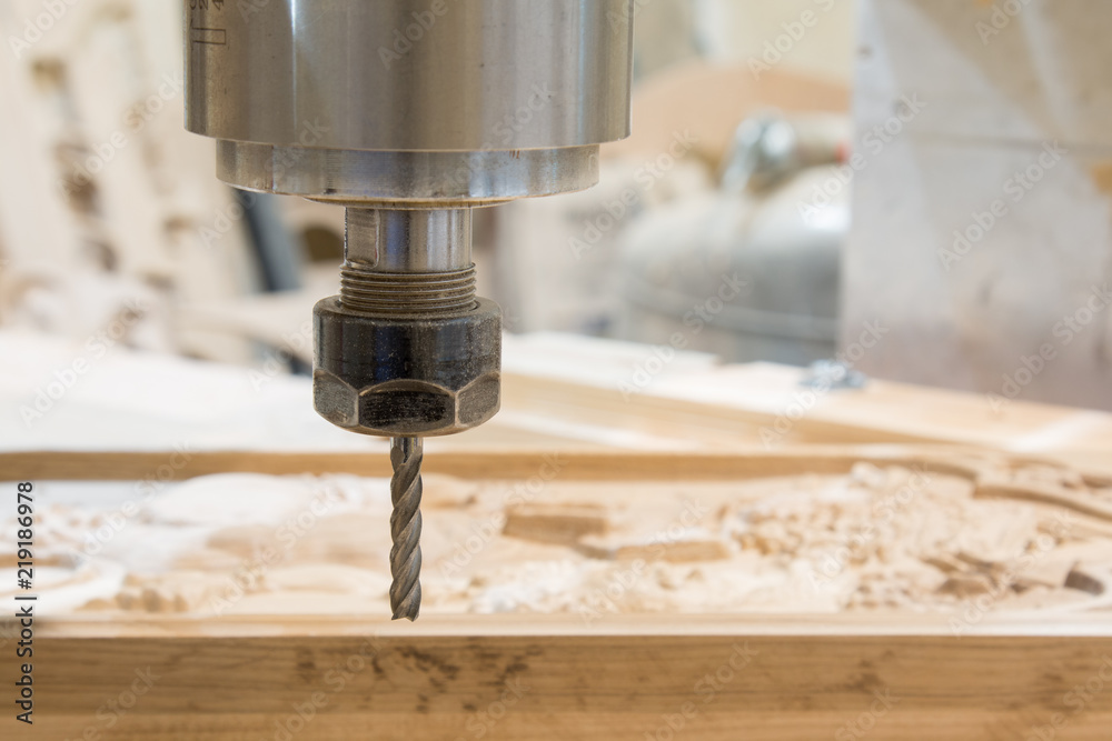 Rotary milling cutter, wooden board and shavings Rotary milling cutter, wooden board and shavings