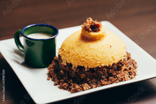 Cuscuz, corn couscous, is a Brazilian tipical food photo