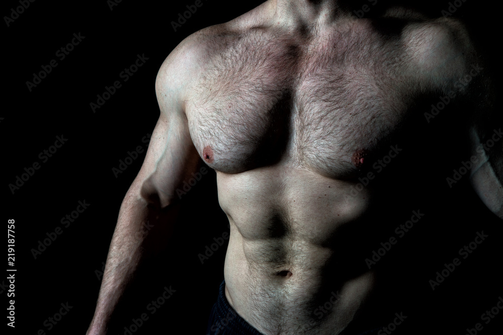 Fotografia do Stock: Torso muscular male body. Bodybuilder achievement  great shape. Sexy naked torso. Chest six pack muscles looks impressing  attractive sexy. Great body result of regular training workout gym  exercises