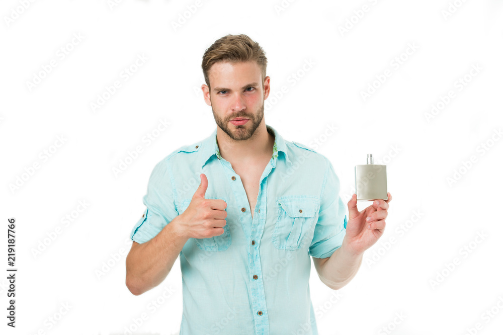 Man confident face recommend perfume shows thumb up gesture. Guy with bristle bottle perfume he likes this fragrance. Male fragrance concept. Man handsome recommend pleasant aroma for male Man confident face recommend perfume shows thumb up gesture. Guy with bristle bottle perfume he likes this fragrance. Male fragrance concept. Man handsome recommend pleasant aroma for male