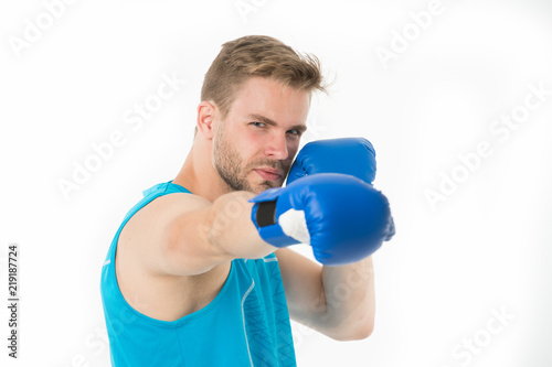 Sportsman boxer concentrated training boxing gloves. Man concentrated face in blue gloves practice fighting skills isolated white background. Boxer practicing before sparring. Boxing is his passion © be free
