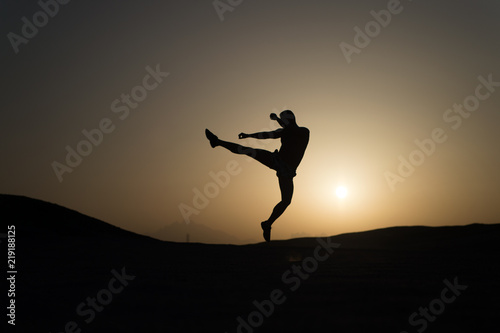 Hit your goal. Silhouette man motion jump in front of sunset sky background. Daily motivation. Healthy lifestyle personal achievements goals and success. Future success depends on your efforts now