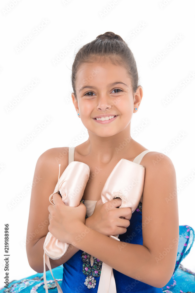 Child happy holds ballet shoes important attribute excellent ballerina. Girl ballerina holds pointe shoes in hand white background. Professional advice. Exercises to develop pointe shoes dance skill Child happy holds ballet shoes important attribute excellent ballerina. Girl ballerina holds pointe shoes in hand white background. Professional advice. Exercises to develop pointe shoes dance skill