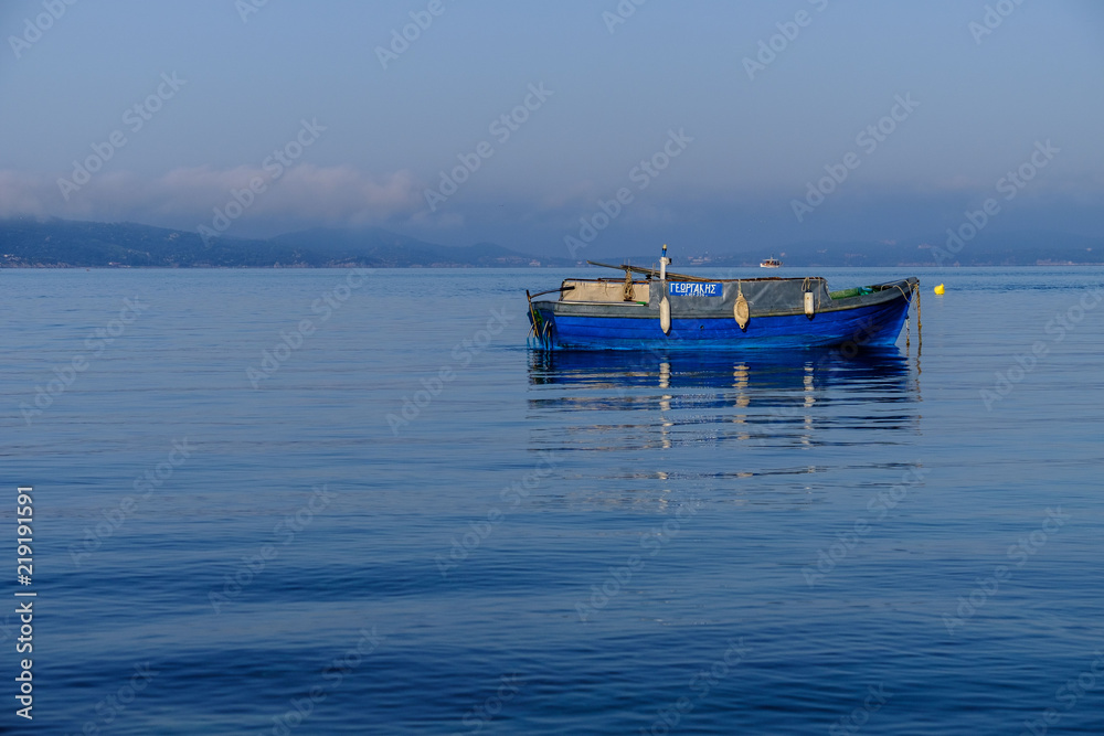 Blue boat, blue sea