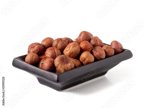 Hazelnut in a dark ceramic plate
