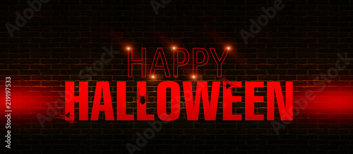 The background of a brick wall with neon text "Halloween", lights and glow. Happy Halloween Holiday