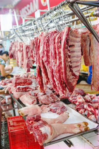 hangiing meat in the market photo