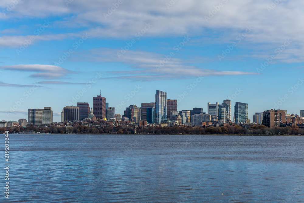 The Boston skyline and Charles River, seen from Cambridge with clouds, Massachusetts.