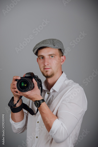 Young man using a professional camera