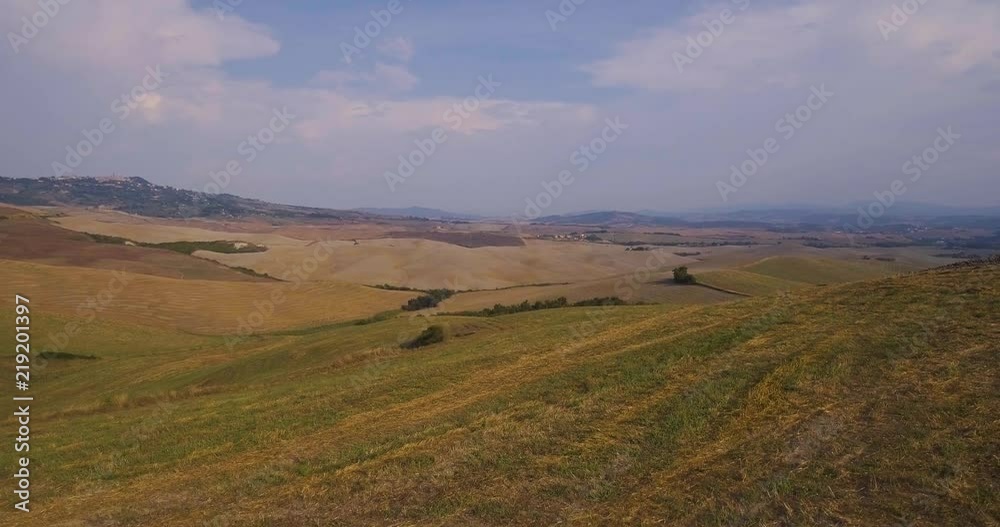 Aerial, gorgeous tuscan fields landscape near the city of Volterra