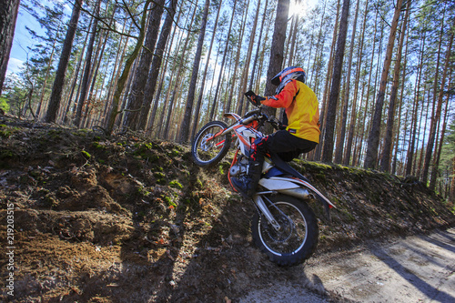 Walk at a sports bike in the forest.