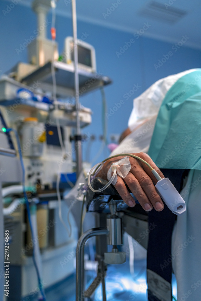 Monitored patient hand and monitors