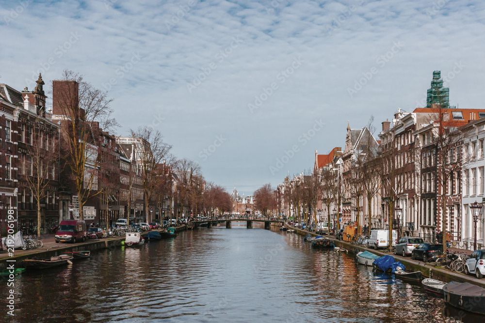 Houses and Boats along a Canal in Downtown Amsterdam, the Netherlands