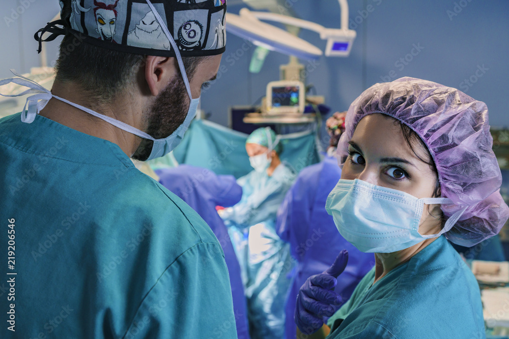 Surgery assistant looking at the camera