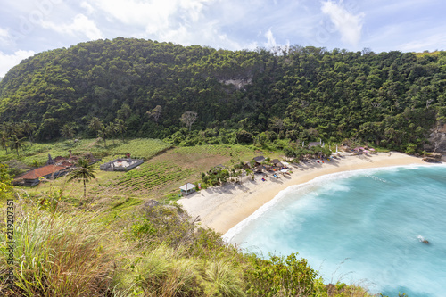 Atuh Beach as well as farm land and a Hindu temple behind it on Nusa Penida, Indonesia. photo