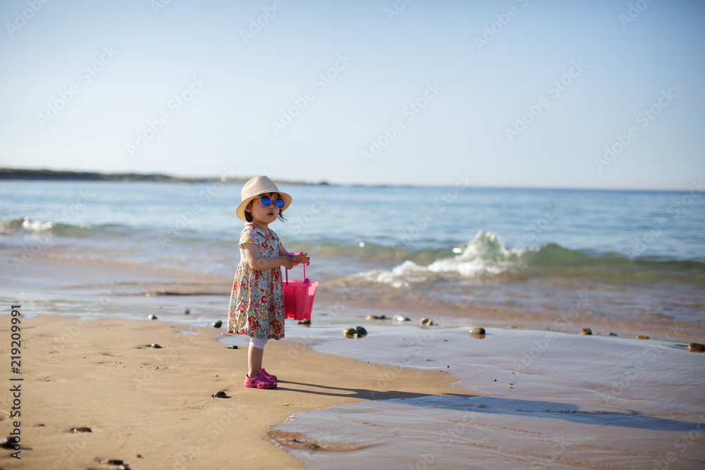 baby girl playing at summer beach baby girl playing at summer beach