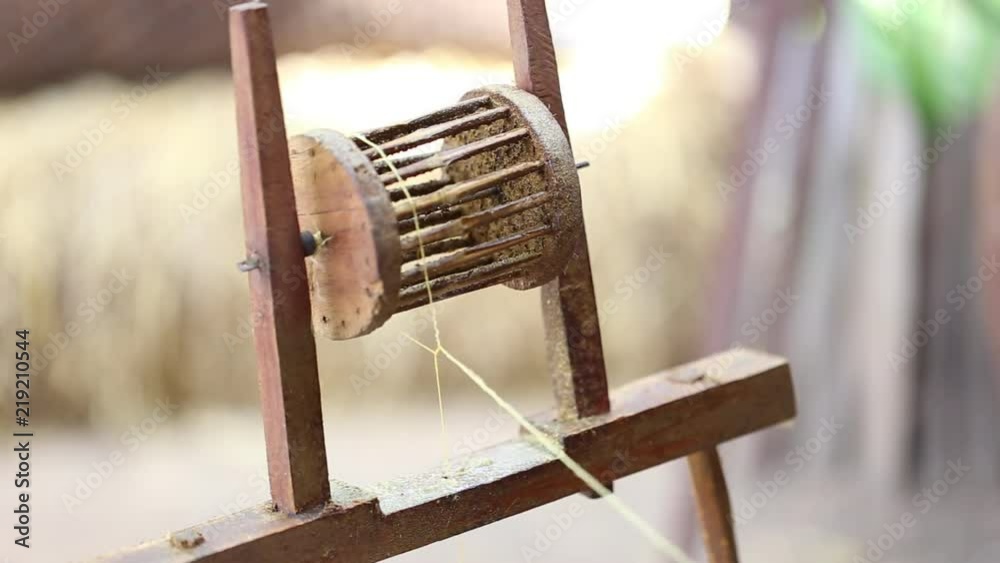 Weaving silk from hand weaving machine and White silk in Thailand. Plants in field Weaving silk from hand weaving machine and White silk in Thailand. Plants in field