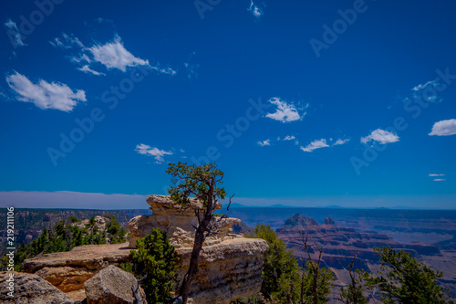 Outdoor view of rock in the border, cliffs above Bright Angel canyon, major tributary of the Grand Canyon, Arizona, view from the north rim photo