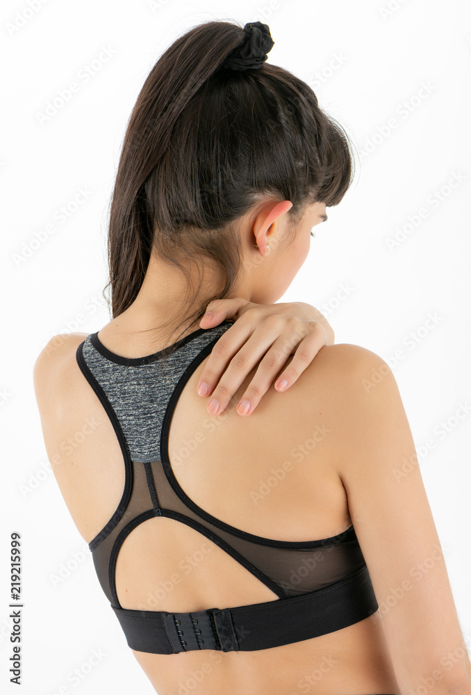 Closeup woman neck and shoulder pain and injury. Health care and medical concept. Closeup woman neck and shoulder pain and injury. Health care and medical concept.
