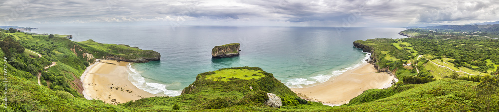 Llanes at North of Spain at Asturias region is an amazing place for enjoying the outdoors with amazing wild and green beaches like this panoramic view of Ballota beach at east of Llanes town, Spain