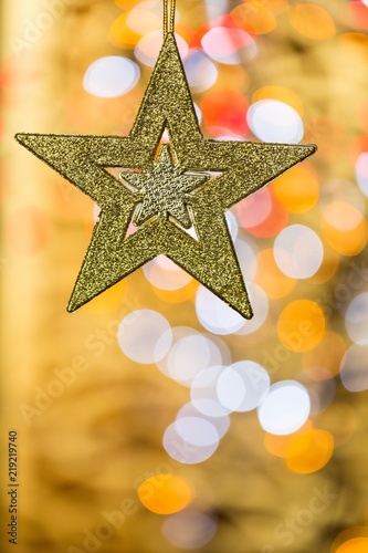 Christmas Star with Blurred Lights on Background