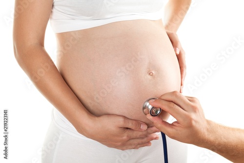 Closeup of Doctor Examining a Pregnant Woman
