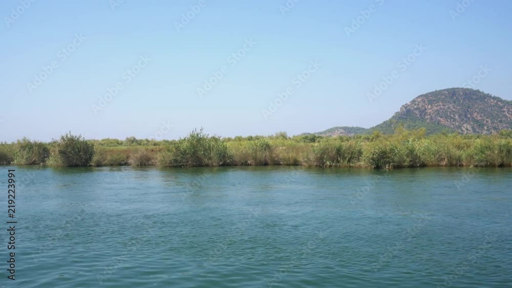 Turkish river journey along green coast view Turkish river journey along green coast view