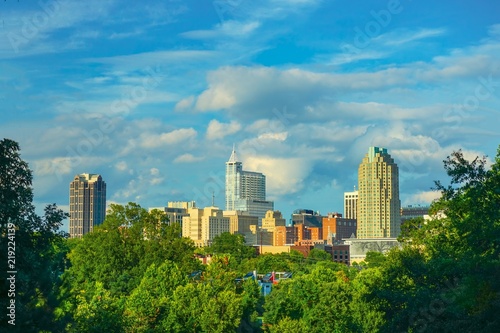 A beautiful cityscape of downtown Raleigh, North Carolina under a blue sky in HDR.