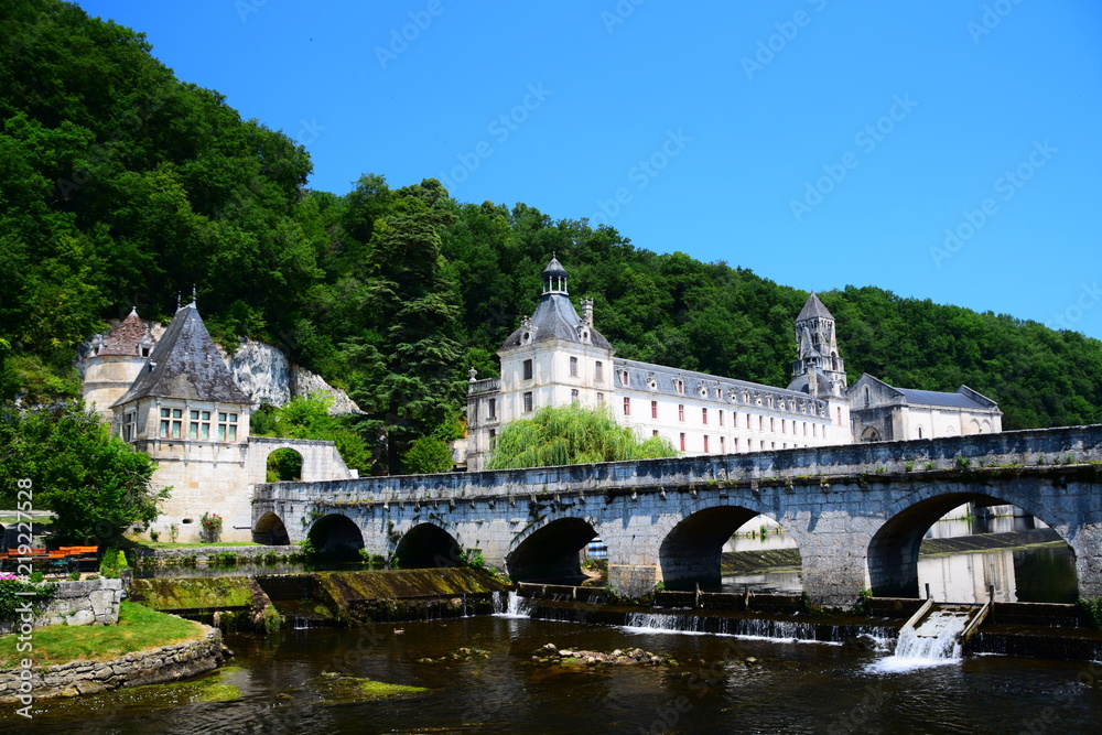 The Benedictine Abbey of Brantome on the Dronne River in Nouvelle Aquitaine, France The Benedictine Abbey of Brantome on the Dronne River in Nouvelle Aquitaine, France