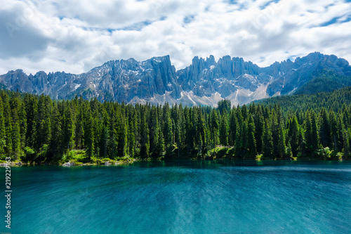 A long exposure landscape of Lake Carezza with Mount Latemar, Bolzano province, South tyrol, Italy.