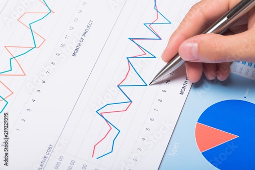 Close-up of a Businessman Analyzing Business Graphs