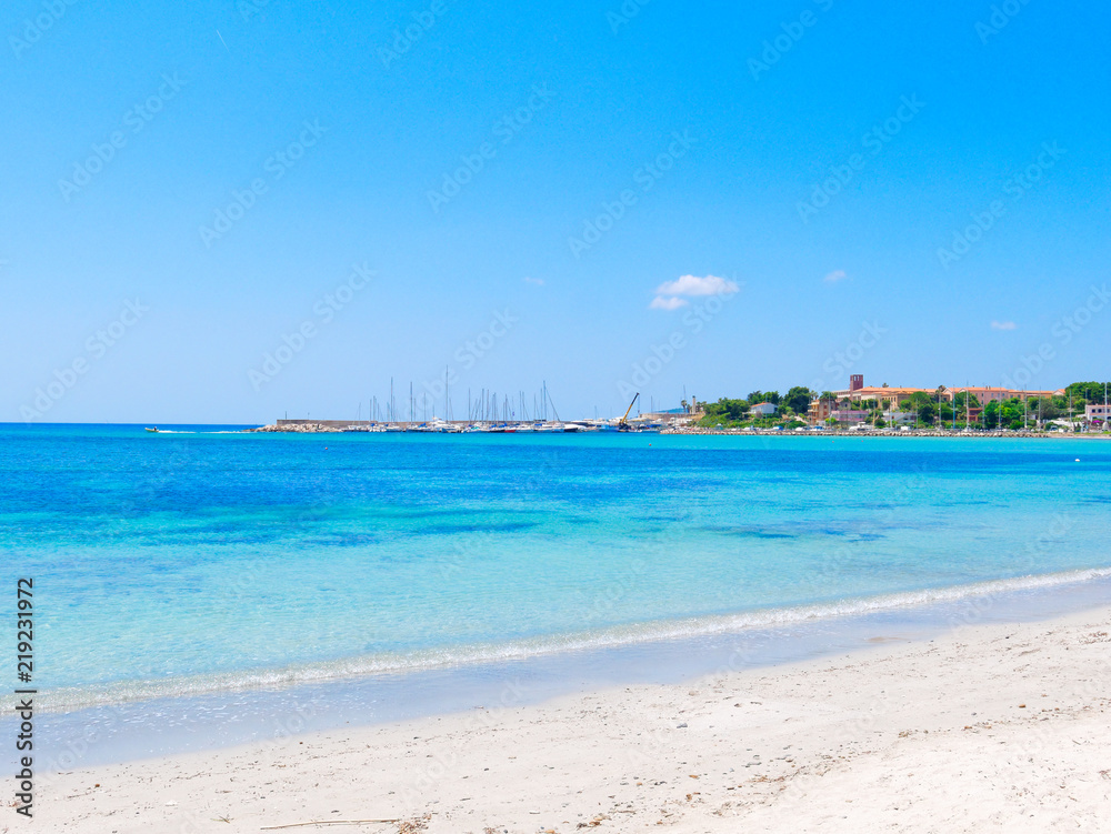 View of the beach and Fertilia in the background. The municipality of Alghero. Sardinia, Italy.