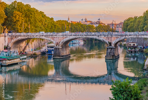 Rome cityscape over Tiber at sunset