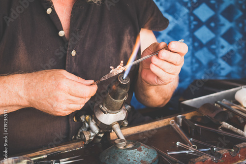 Photography Hands of the handicraftsman making a glass subject at fair of crafts
