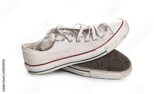 Old white shoes, sneakers isolated on white background