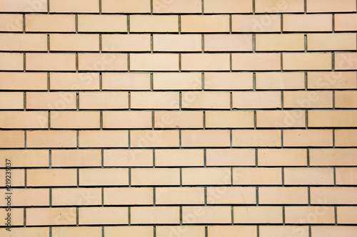 Yellow bricks in the wall as an abstract background