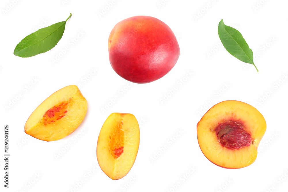 Nectarine with green leaf and slices isolated on white background. top view Nectarine with green leaf and slices isolated on white background. top view