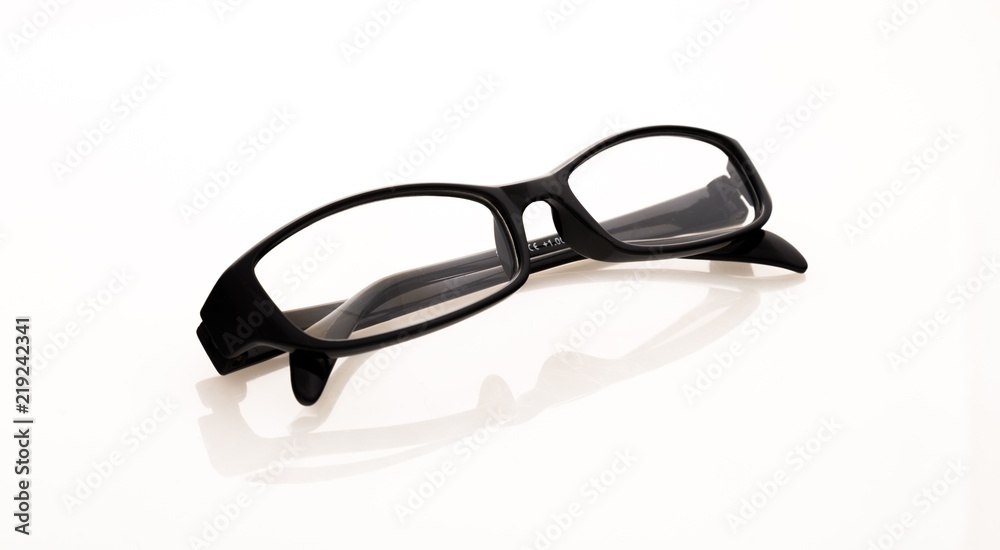 Eyeglasses And Its Reflection Against Light Background Eyeglasses And Its Reflection Against Light Background