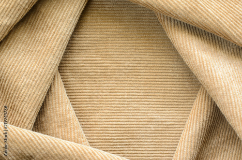 Texture of Beige Velvet Clothes. Geometric Pattern Neatly Stacked Textile Fabric of Corduroy as Blank Background for Your Design
