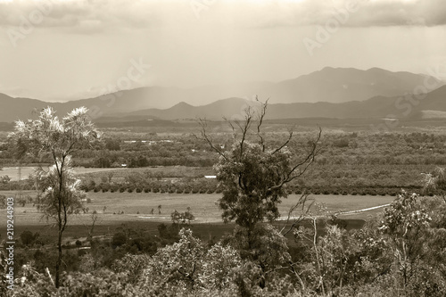 Sepia tinted storm over hills on the Atherton Tableland in Queensland, Australia photo