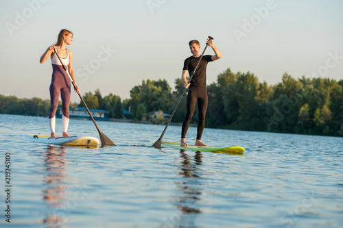 Stand up paddleboard beach people on paddle board