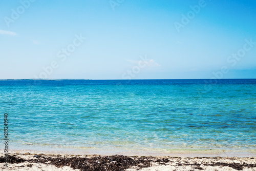 Sea view from tropical beach with sunny sky